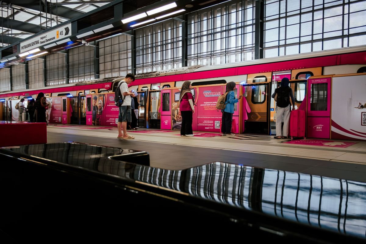 Commuters waiting on an MRT station platform in Malaysia
